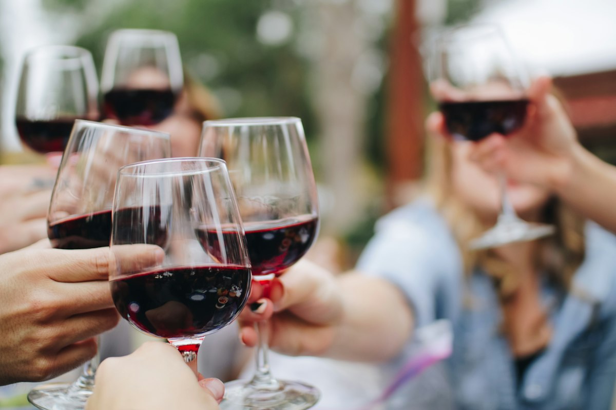 Glass of wine on an evening table with warm ambient restaurant lighting