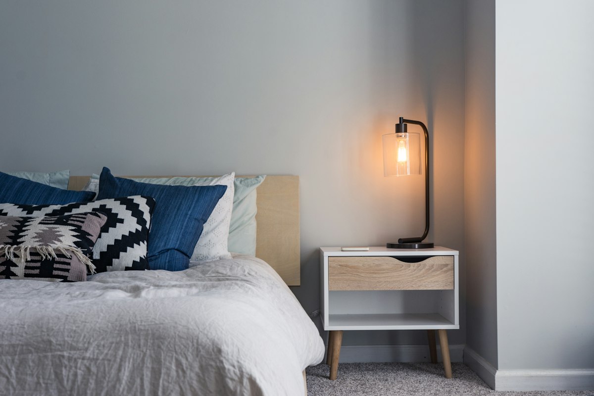 Comfortable domestic British bedroom with radiator and tailored wool duvet